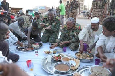 Sudanese army chief General Abdel Fattah Al Burhan eats iftar in Omdurman following the army's gains against the RSF paramilitary on March 13. Screengrab