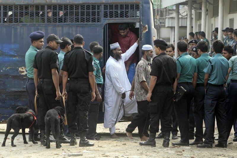 Handcuffed border guards arrive at a special court in Dhaka, Bangladesh, hearing the case involving a 2009 mutiny at the headquarters of the country's border guards. AP Photo/AM Ahad