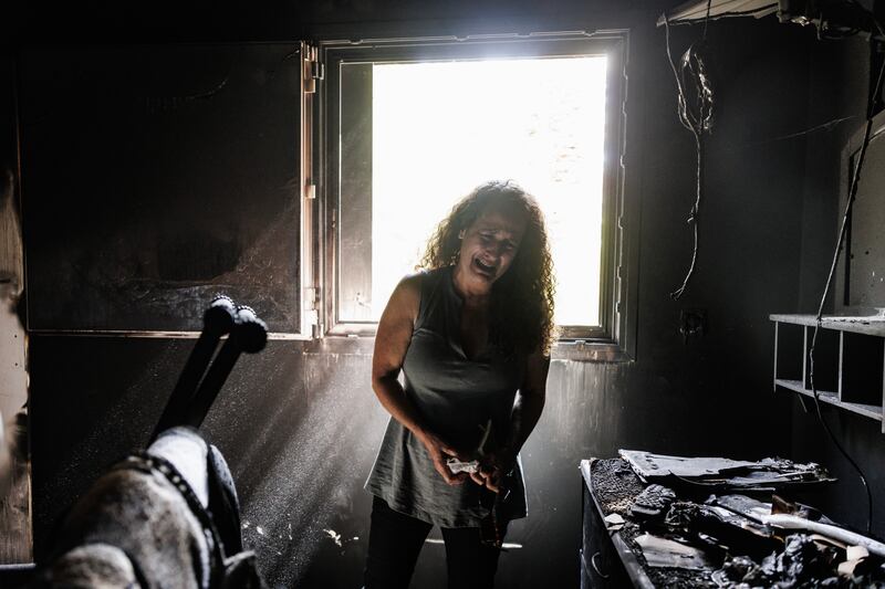 Kibbutz Nir Oz resident Hadas Kalderon, whose children were taken hostage breaks down. Her mother and niece were also killed. Getty Images