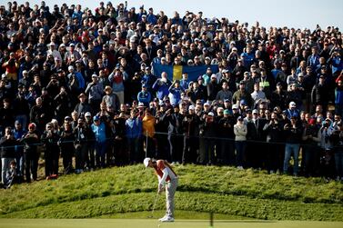 Tommy Fleetwood of England putts on to the seventh green during the 2018 Ryder Cup at The Golf National in Guyancourt, near Paris. EPA