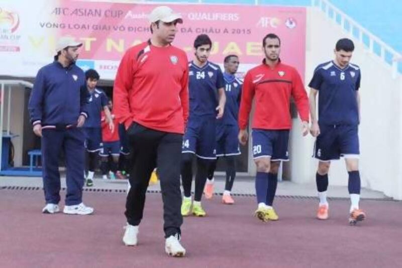 Mahdi Ali, second left, leads his UAE players out on to the pitch for a training session ahead of their match against Vietnam in Hanoi today. Courtesy UAE FA