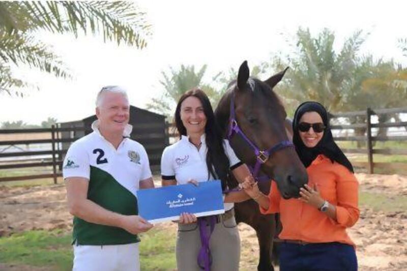 William Horsley, left, is sponsoring Cristina Calin, second from left, who is preparing Webster, second from right, for Reem Alabbar to compete with at international dressage events. Sanable Studio