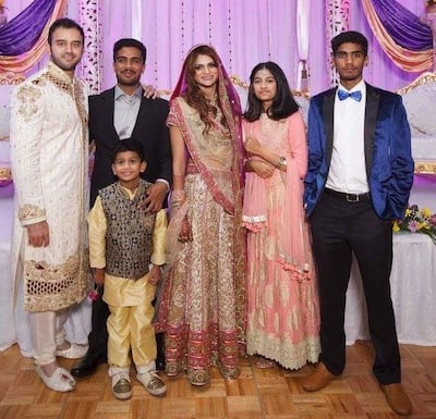 Alia, second right, with her four siblings at her eldest sister Fehmina’s wedding. Her brother Aman is dressed in a black suit. Courtesy Ali family. 