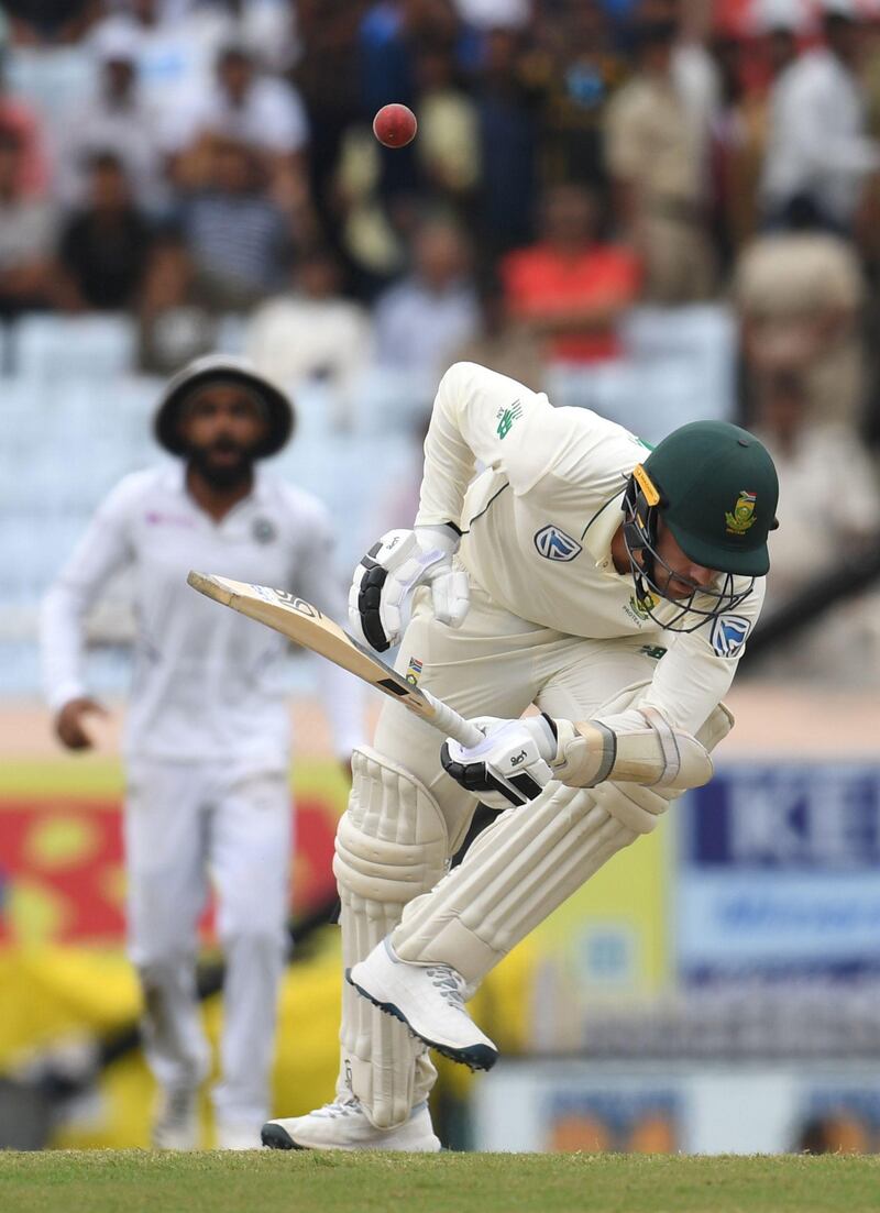 South Africa's Anrich Nortje is hit by a bouncer. AFP