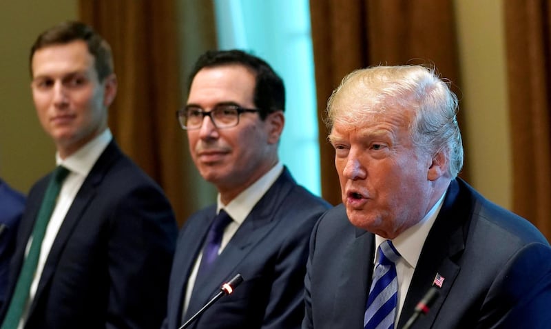 FILE PHOTO: U.S. President Donald Trump, seated with adviser Jared Kushner (L) and Treasury Secretary Steve Mnuchin (C),  speaks during his meeting with the Emir of Kuwait Sheikh Sabah al-Ahmad al-Jaber al-Sabah at the White House in Washington, U.S., September 5, 2018. REUTERS/Kevin Lamarque/File Photo