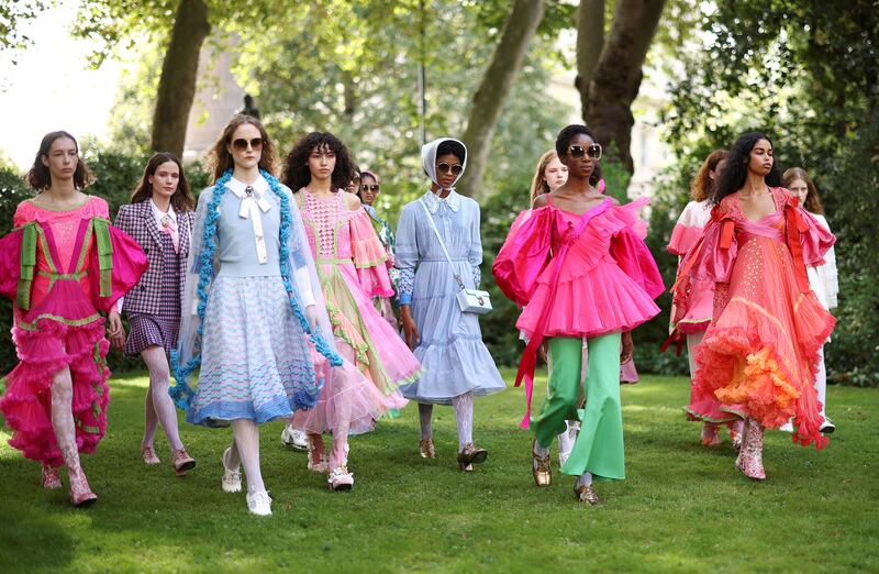 Models present creations during the Bora Aksu Spring/Summer 2022 catwalk show at London Fashion Week in London, Britain, September 17, 2021.  REUTERS / Henry Nicholls