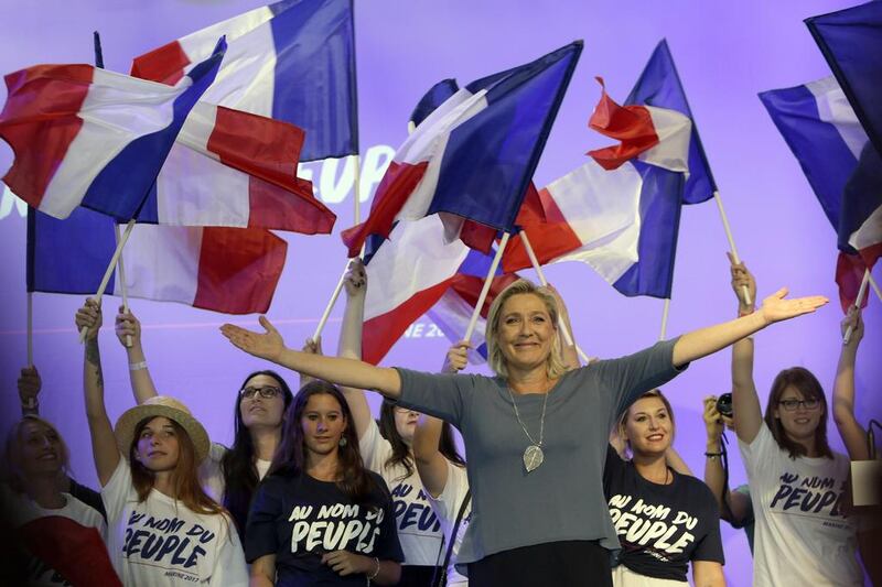 Marine Le Pen, president of France’s far-right Front National, waves to supporters during a meeting in Frejus, southern France, September 18, 2016. Claude Paris / AP Photo