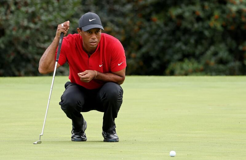 Tiger Woods lines up a putt on the 14th green in the final round at Augusta National Golf Club. AFP