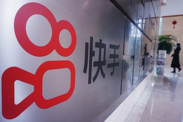 The logo of Chinese video sharing company Kuaishou is seen at its company in Hangzhou. Kuaishou's shares almost tripled on their Hong Kong debut following a $5.4bn IPO that was the biggest for an internet firm since 2019. AFP 