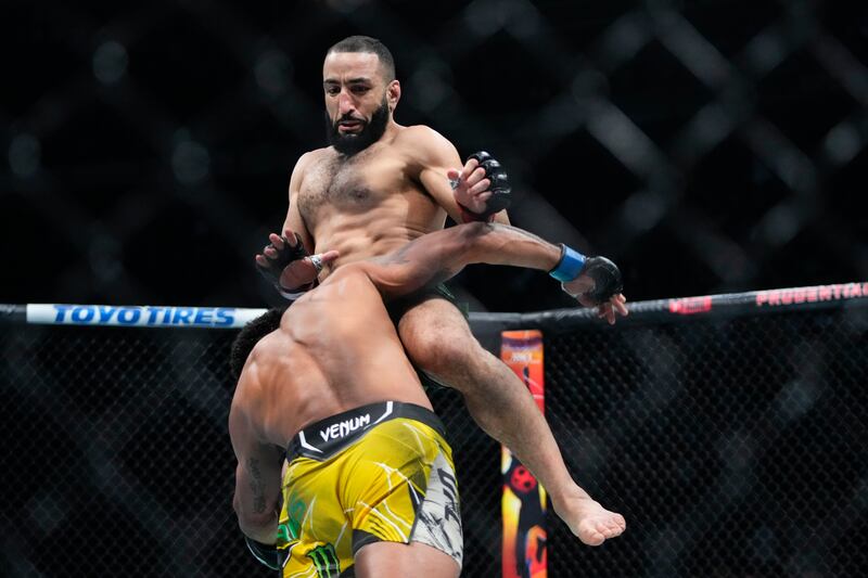 Belal Muhammad knees Gilbert Burns during the first round of their bout at UFC 288. AP