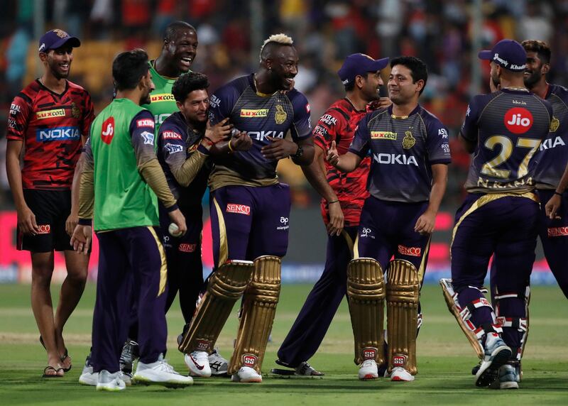 Kolkata Knight Riders' Andre Russell, center, celebrates with teammates after their win in the VIVO IPL T20 cricket match between Royal Challengers Bangalore and Kolkata Knight Riders in Bangalore, India, Friday, April 5, 2019. Kolkata Knight Riders won the match by five wickets. (AP Photo/Aijaz Rahi)