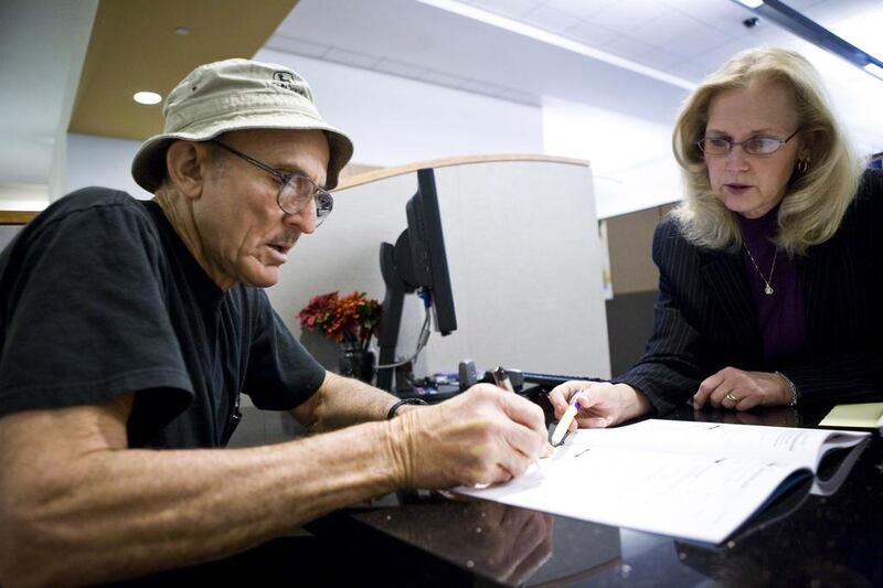 Above, a state worker goes over his retirement options with a Calpers Retirement Program specialist in California. Old people are living longer, and their consumption needs are growing, especially costly medical treatments, says Omar Al Ubaydli. Max Whittaker / Reuters