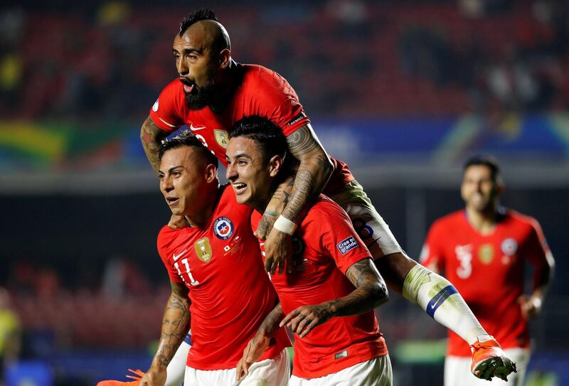 Erick Pulgar, right, of Chile celebrates with teammates Arturo Vidal  and Eduardo Vargas. EPA