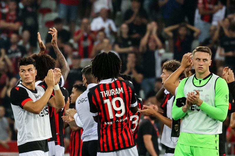 Nice's players greet their supporters at the end of the match. AFP
