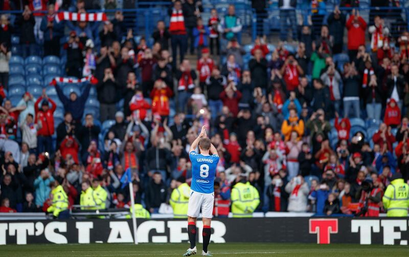 Steven Gerrard applauds the travelling Liverpool supporters during the legends match at Ibrox Stadium. Press Association