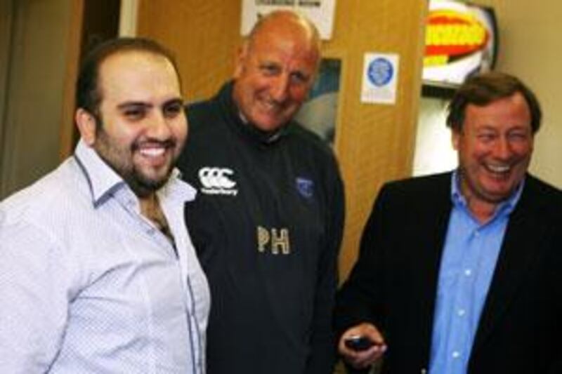 Sulaiman Al Fahim, left, the new chairman of the Portsmouth Football Club, shares a light moment with the team manager Paul Hart and the chief executive Peter Storrie, right, at the club's training ground.