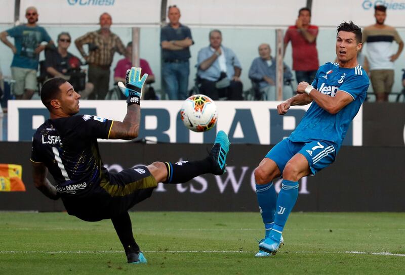Parma's goalkeeper Luigi Sepe, left, makes a save from Ronaldo. AP Photo