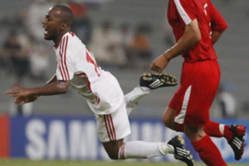 Ismael Matar falls to the ground during the 2010 FIFA World Cup qualifiers at Sheikh Mohammed Bin Zayed Stadium.