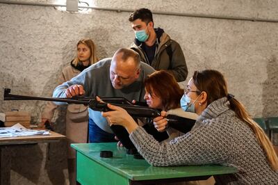 Civilians train in shooting skills for civilians as part of creating a territorial defence system at a local school in Lviv, Ukraine, on February 24, 2022. EPA