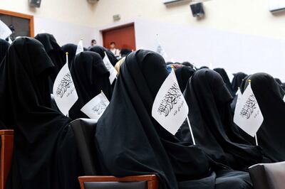 Afghan students listen to women speakers prior to their pro-Taliban rally outside the Shaheed Rabbani Education University in Kabul.  