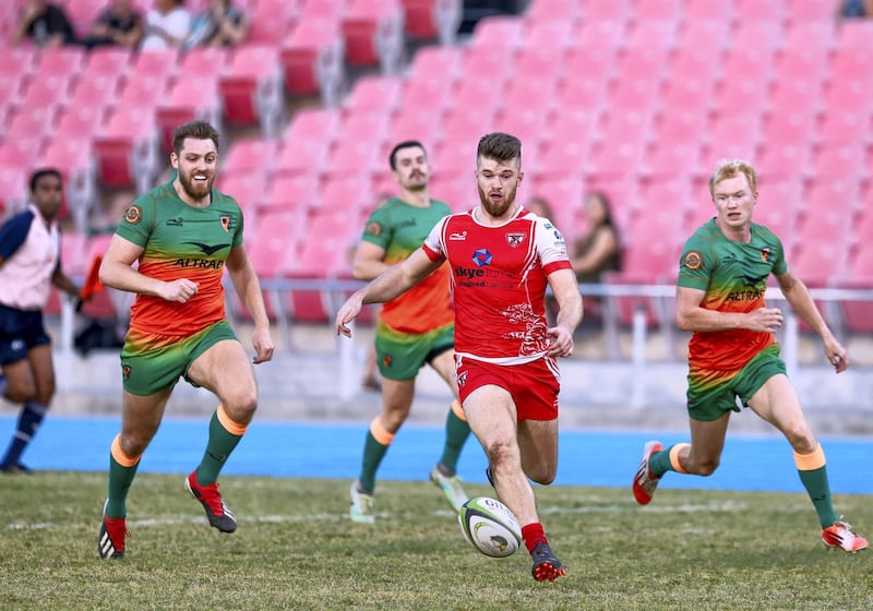 Dubai, United Arab Emirates, November 8, 2019.  
SUBJECT NAME / MATCH / COMPETITION: West Asia Premiership: Dubai Knights Eagles v Dubai Tigers, Domestic top division match.
--(red)  Matthew Jones of ther Dubai Tigers chases the ball.
Victor Besa/The National
Section:  SP
Reporter:  Paul Radley