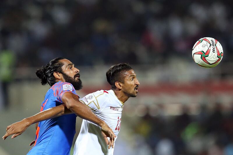 Mohamed Saad Alromaihi, right, of Bahrain in action against Jhingan. EPA