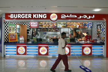 Twitter users called on people across the Middle East to boycott Burger King after it released an advert making light of the Suez Canal crisis. Ryan Carter / The National