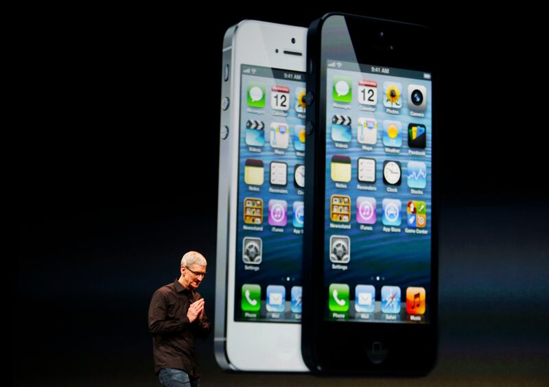 Apple CEO Tim Cook takes to the stage following the reveal of the iPhone 5 in San Francisco, California, on September 12, 2012. This was the first 4-inch screen and the phone was faster and slimmer. Reuters