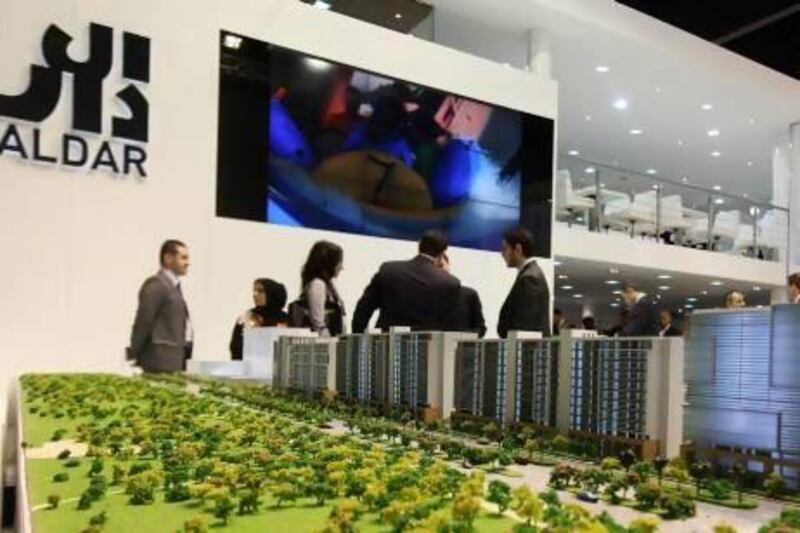 Property firms outperformed other sectors on the ADX following the merger of Aldar and Sorouh. Pawan Singh / The National