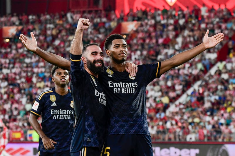 Real Madrid's Jude Bellingham, right, celebrates after scoring against Almeria at Power Horse Stadium on August 19, 2023. EPA
