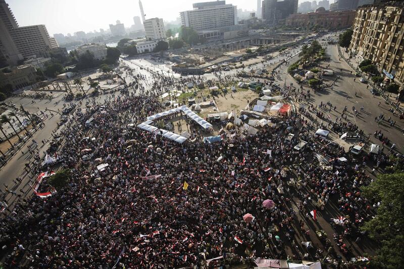 Thousands of citizens gather to demonstrate against Egyptian president Mohamed Morsi and the Muslim Brotherhood in Egypt's landmark Tahrir square on June 28, 2013. Supporters and opponents of Egyptian Islamist President Mohamed Morsi took to the streets for rival protests a year after his election, as clashes in Alexandria raised fears of widespread unrest. AFP PHOTO/GIANLUIGI GUERCIA (Photo by GIANLUIGI GUERCIA / AFP)