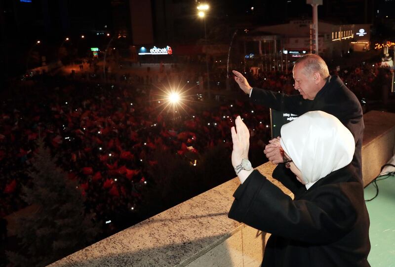 Turkish president Recep Tayyip Erdogan and his wife Emine greeting their supporters at the balcony of his ruling Justice and Development Party (AK Party) after early results of local election in Ankara.  EPA