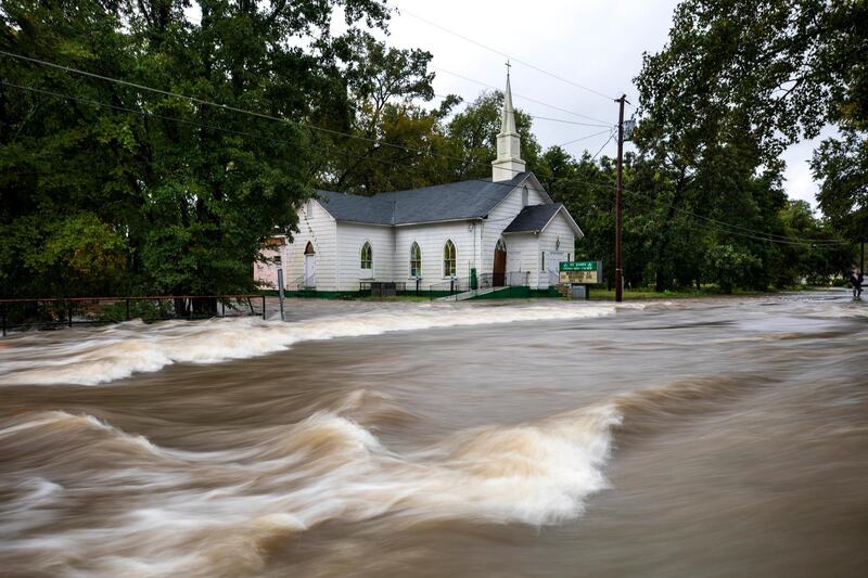 Floodwaters from Hurricane Florence rush down Cool Spring Street, inundating the St James Church in Fayetteville, North Carolina. EPA