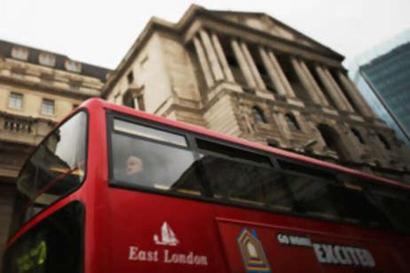 LONDON - SEPTEMBER 02:  (EDITOR'S NOTE: A TILT AND SHIFT LENS WAS USED IN THE CREATION OF THIS IMAGE) A man looks out of the bus as it passes the Bank Of England on September 2, 2008 in central London, England. The Paris-based Organisation for Economic Cooperation and Development (OECD) has predicted that the UK economy will fall into recession during the second half of this year.  (Photo by Daniel Berehulak/Getty Images) *** Local Caption ***  GYI0055607148.jpg