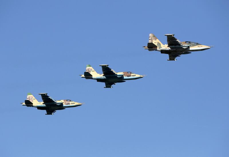 FILE -  In this July 14, 2016, file, photo, Iraqi Air Force jets take part in a military parade in Baghdad, Iraq. Syriaâ€™s state news agency said Sunday, Dec. 30, 2018 that President Bashar Assad has authorized Iraqi forces to attack the Islamic State group inside Syria without waiting for permission from authorities in Damascus.  (AP Photo/Hadi Mizban, File)