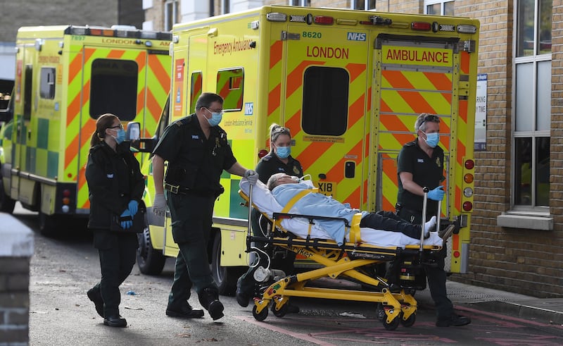 NHS ambulance staff outside a hospital in London in November. EPA