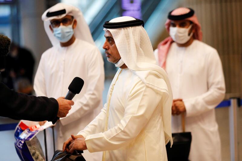 A member of the media interviews a businessman after he landed in Israel on a flydubai flight at Ben Gurion International Airport, near Tel Aviv, Israel on November 26, 2020. REUTERS/Amir Cohen