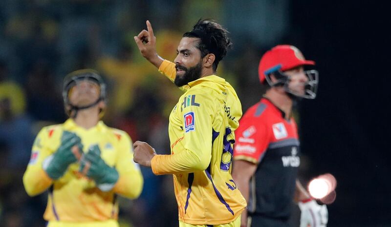 Chennai Super Kings' Ravindra Jadeja, center, celebrates the dismissal of Royal Challengers Bangalore's Colin de Grandhomme, right, during the VIVO IPL T20 cricket match between Chennai Super Kings and Royal Challengers Bangalore in Chennai, India. AP Photo