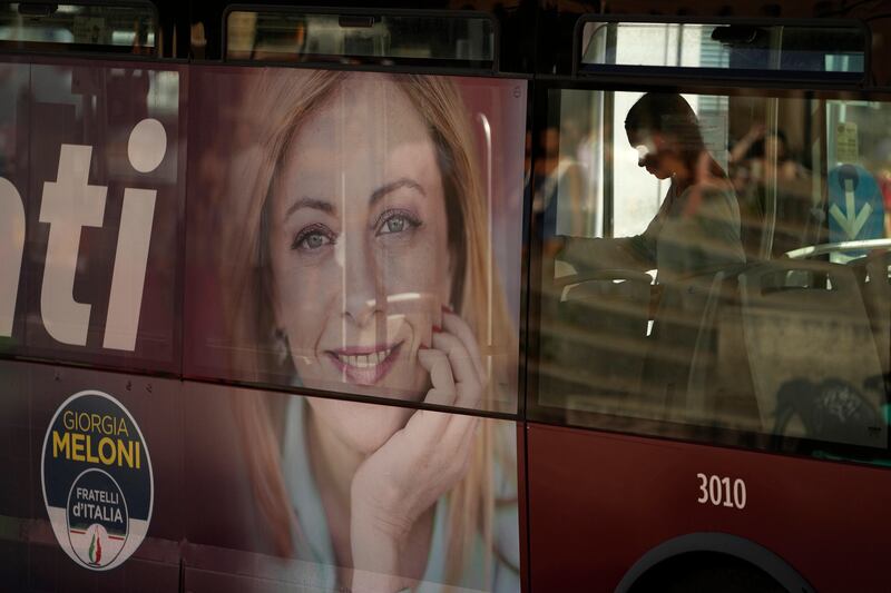 A poster of Giorgia Meloni on the side of a bus in Rome. AP
