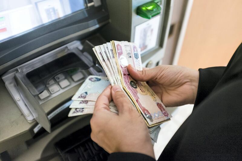 DUBAI, UNITED ARAB EMIRATES - Jan 24, 2018. 

A woman withdraws cash from Dubai Islamic Bank's ATM in Dubai Mall.

(Photo by Reem Mohammed/The National)

Reporter:  Section: NA