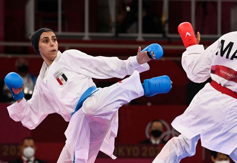 Bronze-medal winning Giana Lotfy (L), of Egypt, competes against Morocco's Btissam Sadini in the women's kumite +61kg karate.