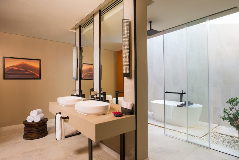 Bathrooms in the villas have twin indoor showers and an outdoor bathtub.