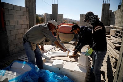 Palestinian labourers at work in the occupied West Bank. Reuters