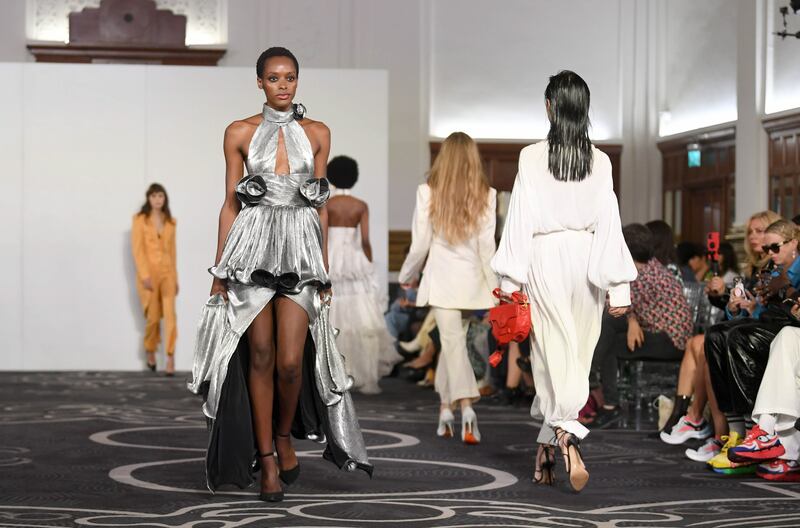 Models present creations by Helen Anthony during London Fashion Week. EPA