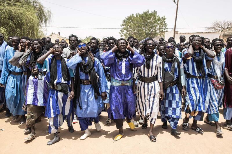 Baye Fall followers on their way to the Great Mosque of Touba in Mbacke. The Baye Fall is a Senegalese Muslim sect and a branch of the Mouride brotherhood. The Baye Fall believe that physical labour, such as farming, construction work and cooking, is an act of prayer and devotion. They are well known for their colourful clothing, dreadlocks and mass chanting. AFP