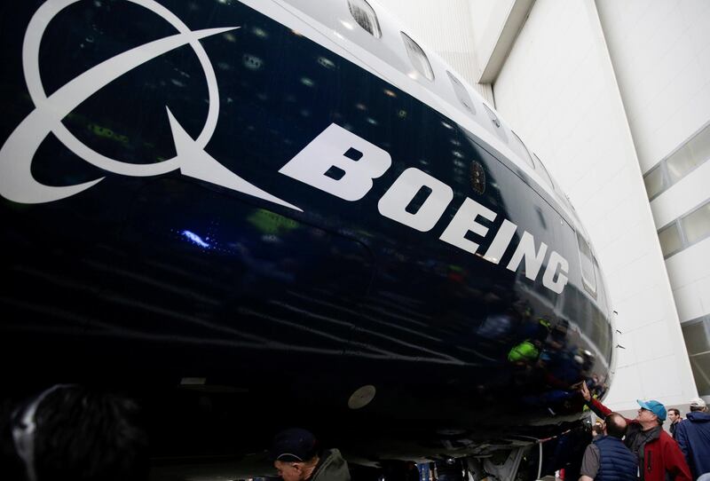 FILE PHOTO: Employees are pictured as the first Boeing 737 MAX 7 is unveiled in Renton, Washington, U.S. February 5, 2018. REUTERS/Jason Redmond/File Photo