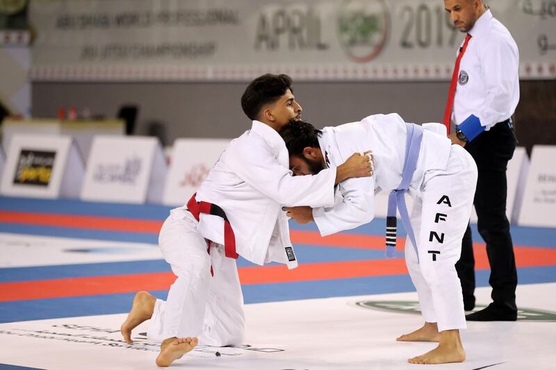 Abu Dhabi, United Arab Emirates - November 10, 2018: Khalifa Nassrati Al Blooshi (L) and Ali Hassan fight in the Mens -62Kg in the inaugural Vice PresidentÕs Cup Round-1 in Jiu-Jitsu. Saturday, Novemeber 10th, 2018 at Al Jazira Sports and Cultural Club, Abu Dhabi. Chris Whiteoak / The National

