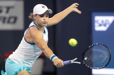 Ashleigh Barty, of Australia, returns the ball to Petra Kvitova, of Czech Republic, during the Miami Open tennis tournament, Tuesday, March 26, 2019, in Miami Gardens, Fla. (AP Photo/Luis M. Alvarez)