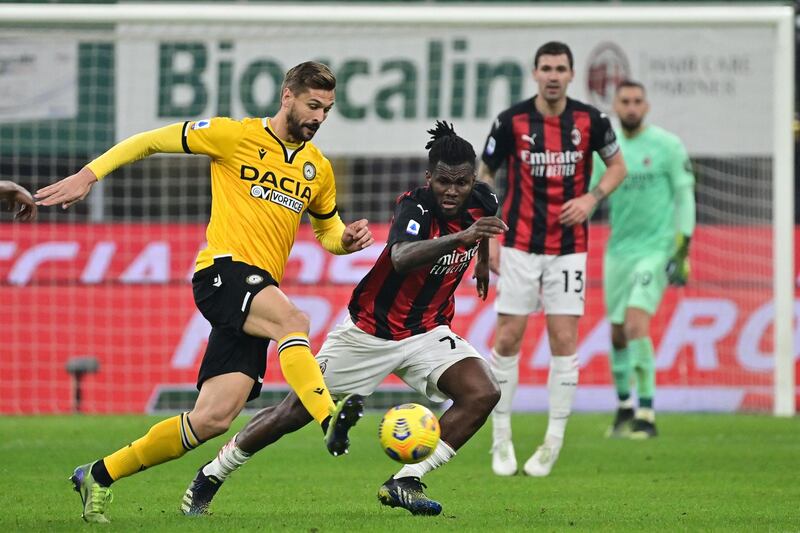 Udinese's Spanish forward Fernando Llorente challenges AC Milan's Ivorian midfielder Franck Kessie. AFP