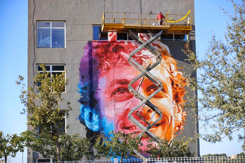 A giant mural featuring Valentino Rossi is painted on a facade, prior to the the Valencia Grand Prix at the Ricardo Tormo racetrack. AFP